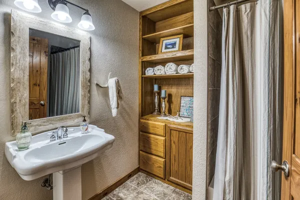 a bathroom with a sink and a mirror