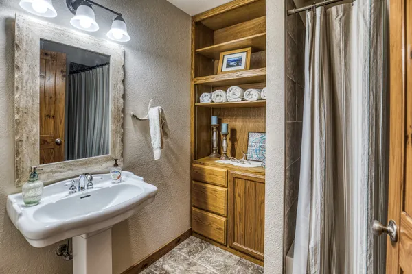 a bathroom with a sink and a mirror
