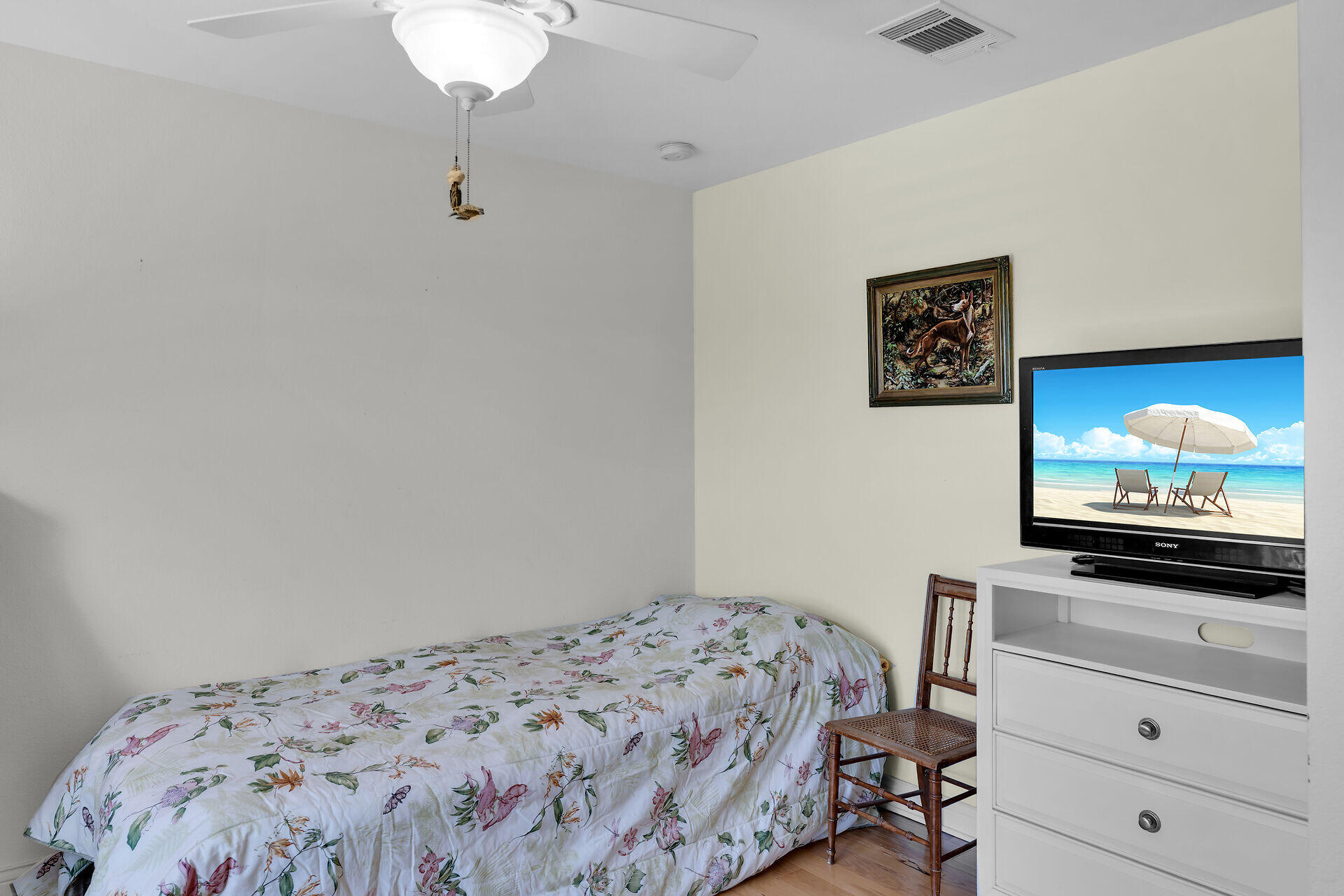 30246 Watson Boulevard Big Pine Key, FL 33043 - Photo 12 of 48 a bedroom with a bed and a flat screen tv