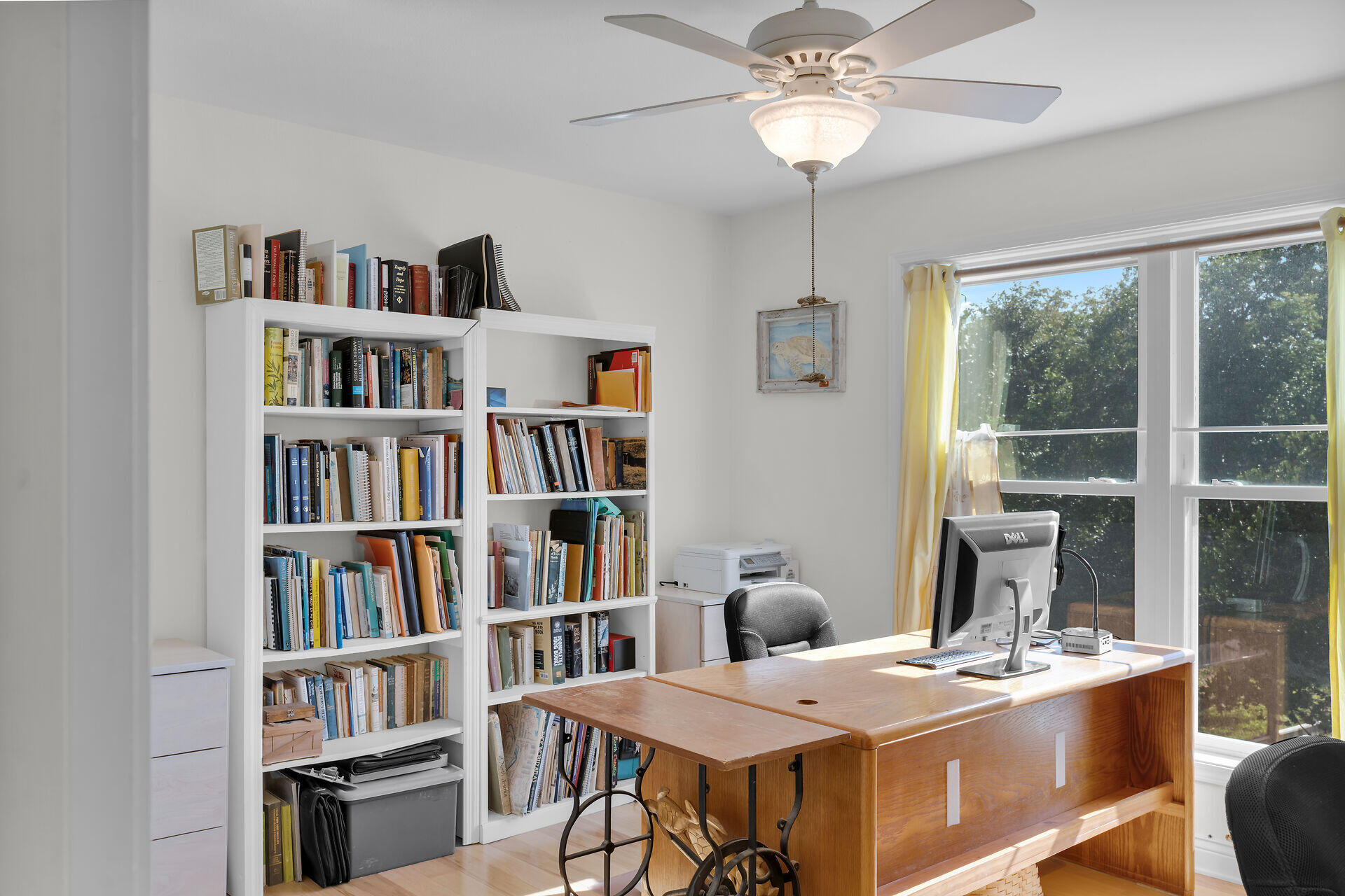 30246 Watson Boulevard Big Pine Key, FL 33043 - Photo 13 of 48 a room with furniture a bookshelf and a window