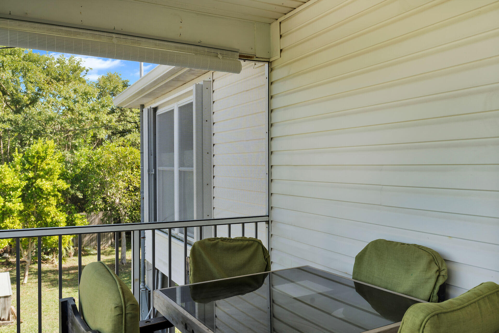 30246 Watson Boulevard Big Pine Key, FL 33043 - Photo 18 of 48 a balcony with wooden floor and furniture
