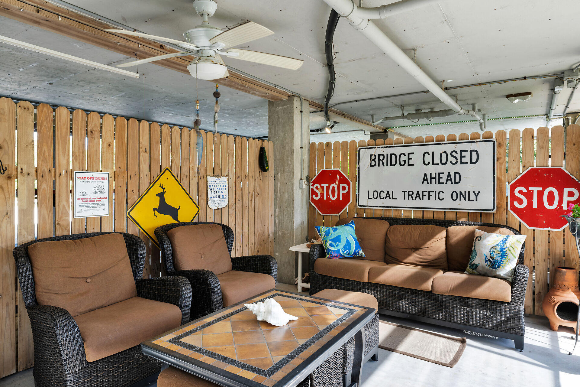 30246 Watson Boulevard Big Pine Key, FL 33043 - Photo 20 of 48 a couch sitting in a living room next to a window