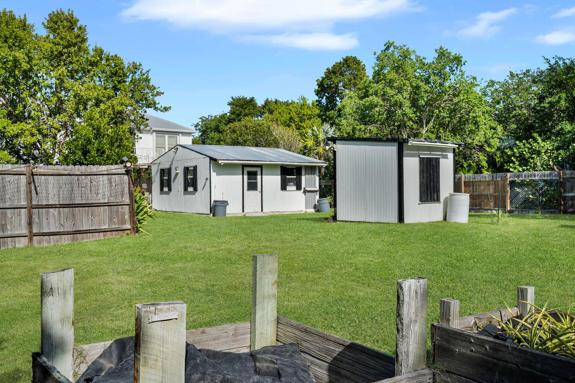 30246 Watson Boulevard Big Pine Key, FL 33043 - Photo 24 of 48 a view of a house with backyard sitting area and garden