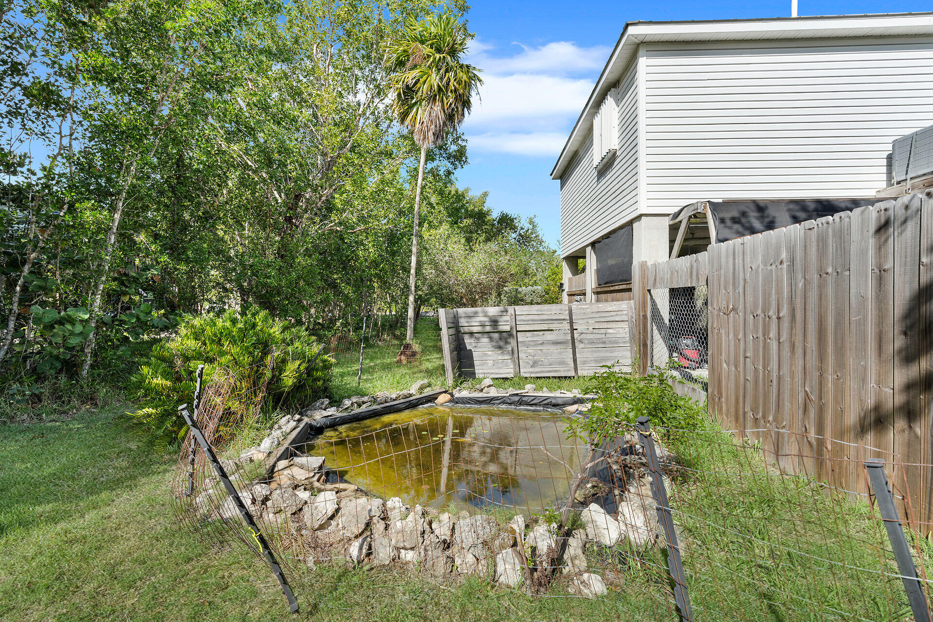 30246 Watson Boulevard Big Pine Key, FL 33043 - Photo 30 of 48 a view of a back yard of the house