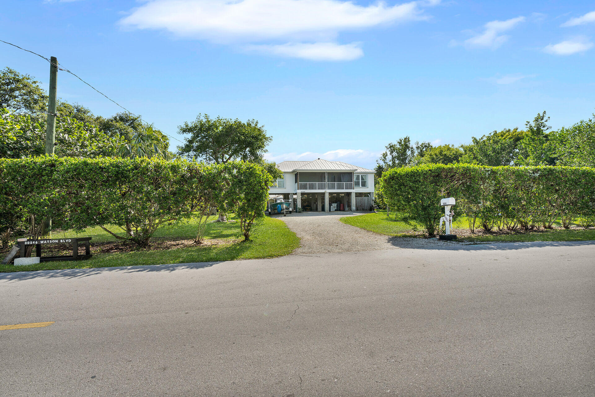 30246 Watson Boulevard Big Pine Key, FL 33043 - Photo 33 of 48 a view of a house with a yard and street view