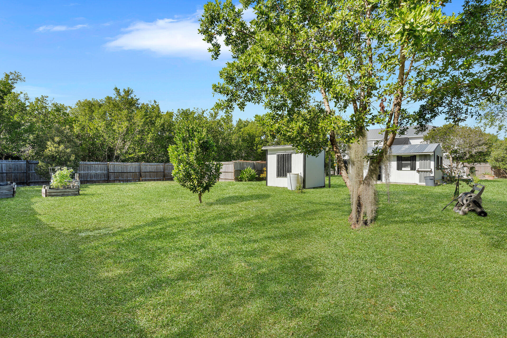 30246 Watson Boulevard Big Pine Key, FL 33043 - Photo 4 of 48 a front view of a house with a yard and trees