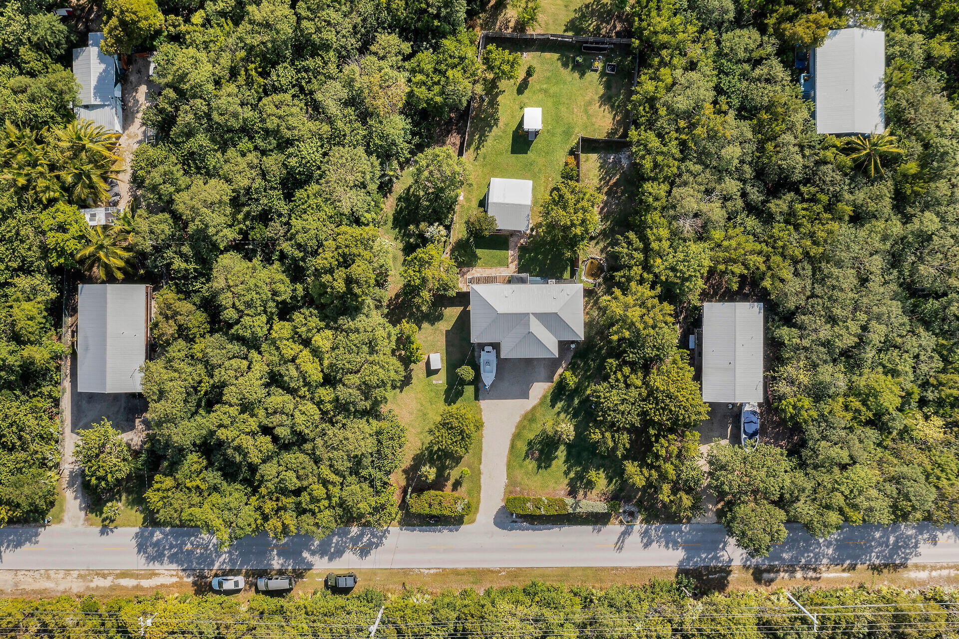 30246 Watson Boulevard Big Pine Key, FL 33043 - Photo 46 of 48 front view of a house with a yard