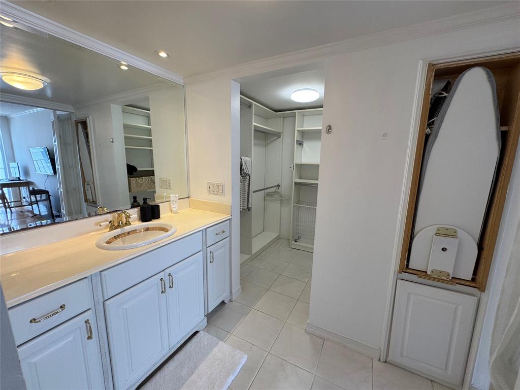 1010 South Ocean Boulevard, Unit 1612 Pompano Beach, FL 33062 - Photo 16 of 35 a bathroom with a double vanity sink a mirror and a shower