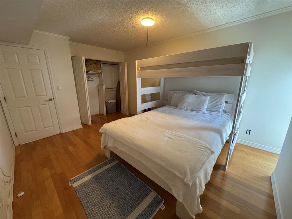 1010 South Ocean Boulevard, Unit 1612 Pompano Beach, FL 33062 - Photo 18 of 35 a bedroom with a bed and a lamp on dresser