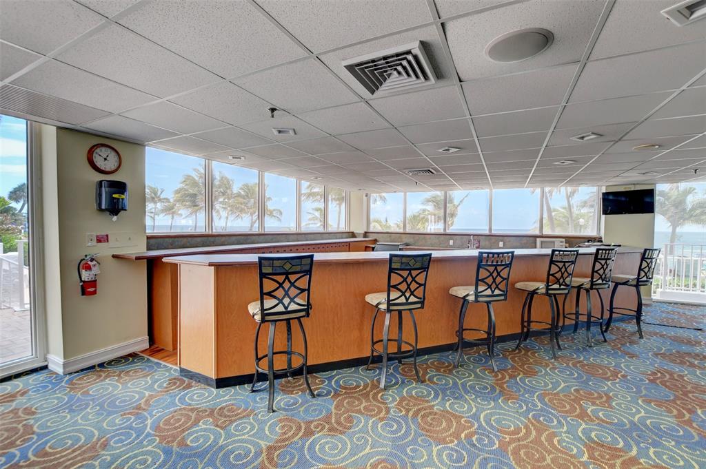 1010 South Ocean Boulevard, Unit 1612 Pompano Beach, FL 33062 - Photo 29 of 35 a room with lots of wooden furniture
