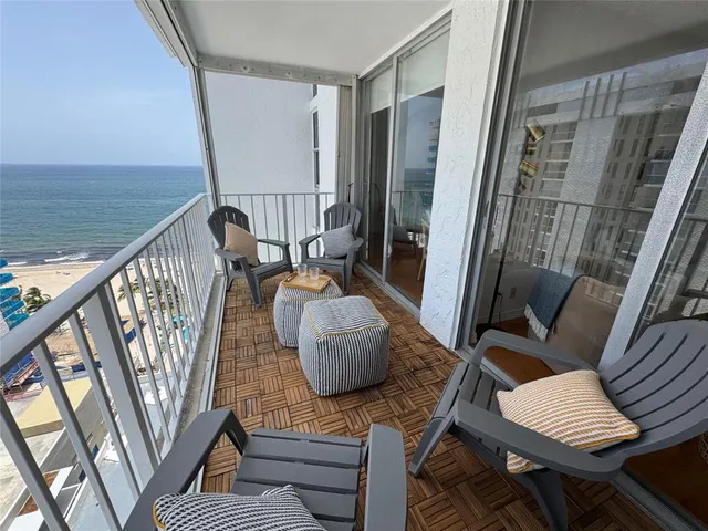 a view of balcony with furniture