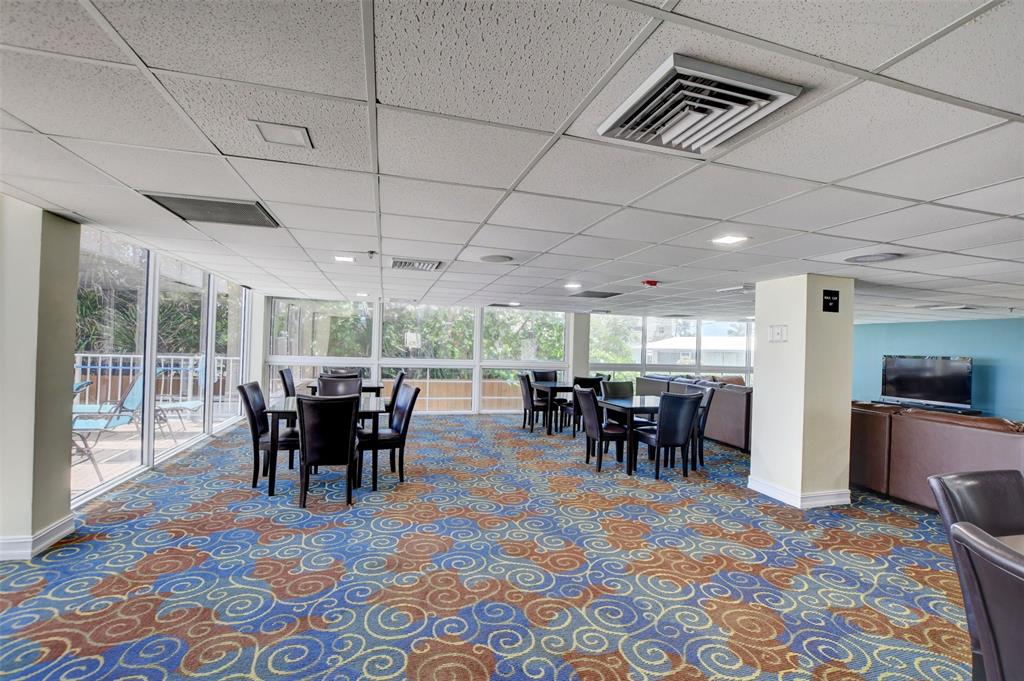 1010 South Ocean Boulevard, Unit 1612 Pompano Beach, FL 33062 - Photo 34 of 35 a view of a dining room with furniture window and wooden floor