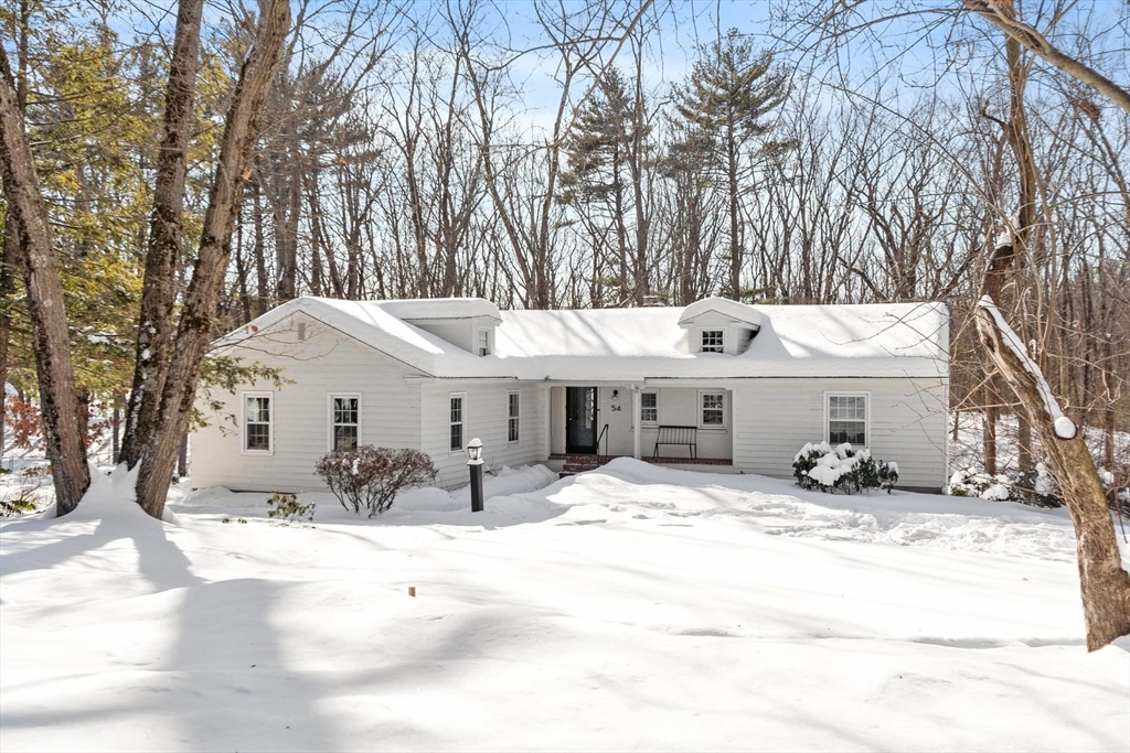 a view of a house with a snow in the yard