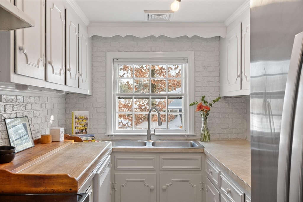 54 Birch Road Andover, MA 01810 - Photo 12 of 37 a kitchen with a stove and a sink