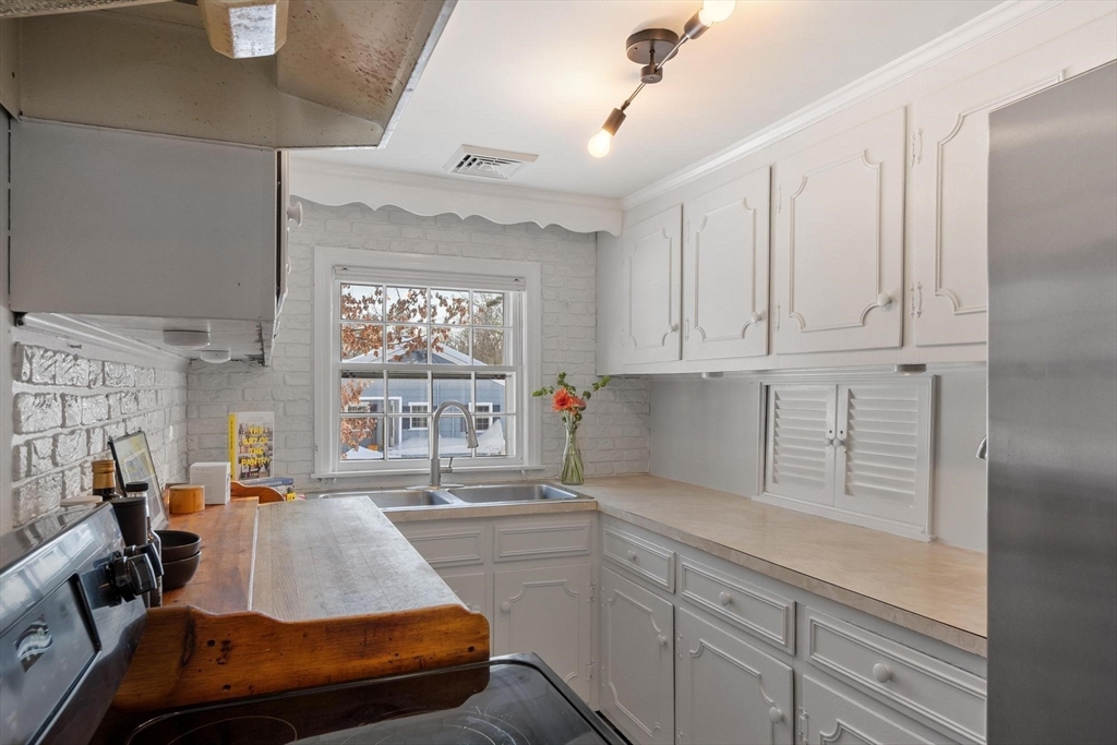 54 Birch Road Andover, MA 01810 - Photo 13 of 37 a bed room with a bed and a large window