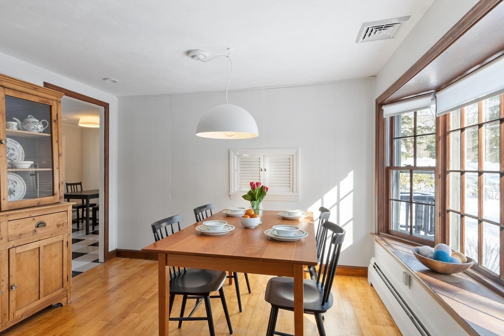 54 Birch Road Andover, MA 01810 - Photo 14 of 37 a view of a dining room with furniture window and wooden floor
