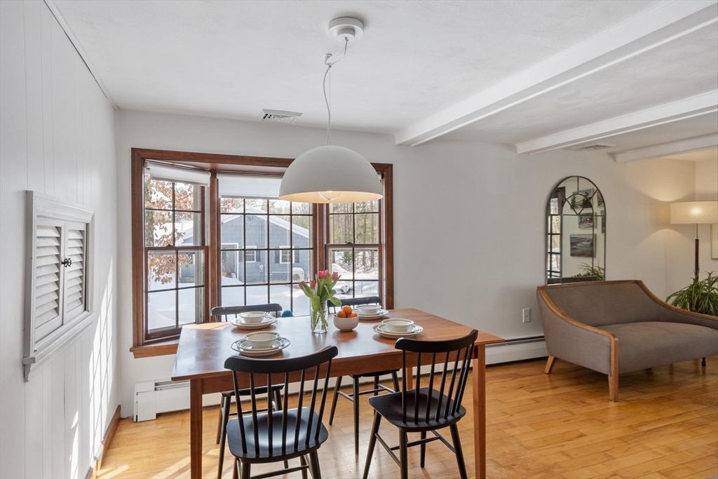 54 Birch Road Andover, MA 01810 - Photo 15 of 37 a view of a dining room with furniture window and outside view