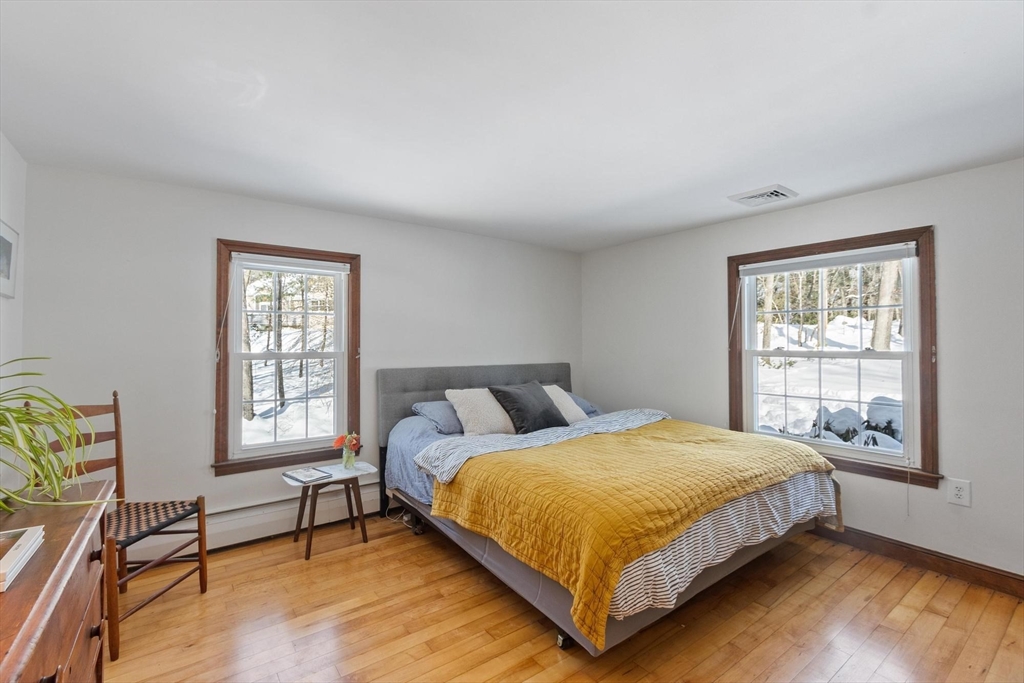 54 Birch Road Andover, MA 01810 - Photo 20 of 37 a bedroom with a bed chair and window
