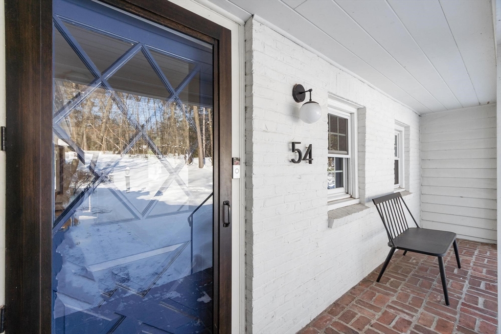 54 Birch Road Andover, MA 01810 - Photo 2 of 37 a view of a livingroom with furniture and front door