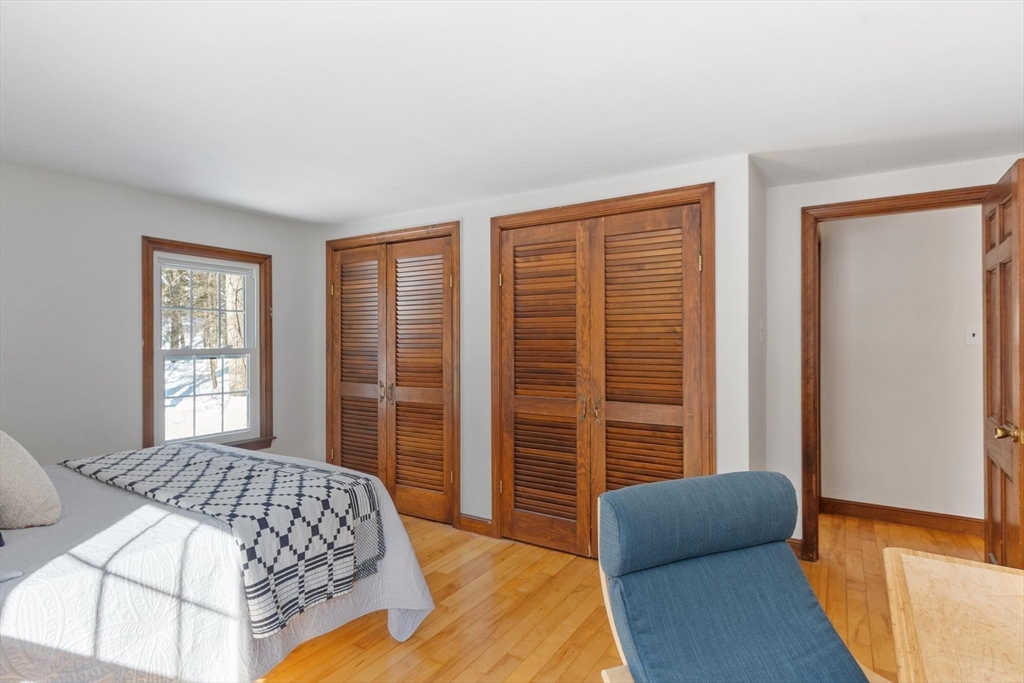 54 Birch Road Andover, MA 01810 - Photo 22 of 37 a bedroom with a bed and a couch