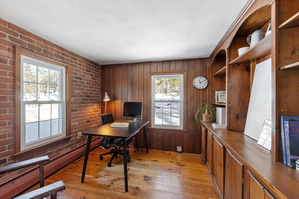54 Birch Road Andover, MA 01810 - Photo 27 of 37 a view of a workspace with furniture and a window