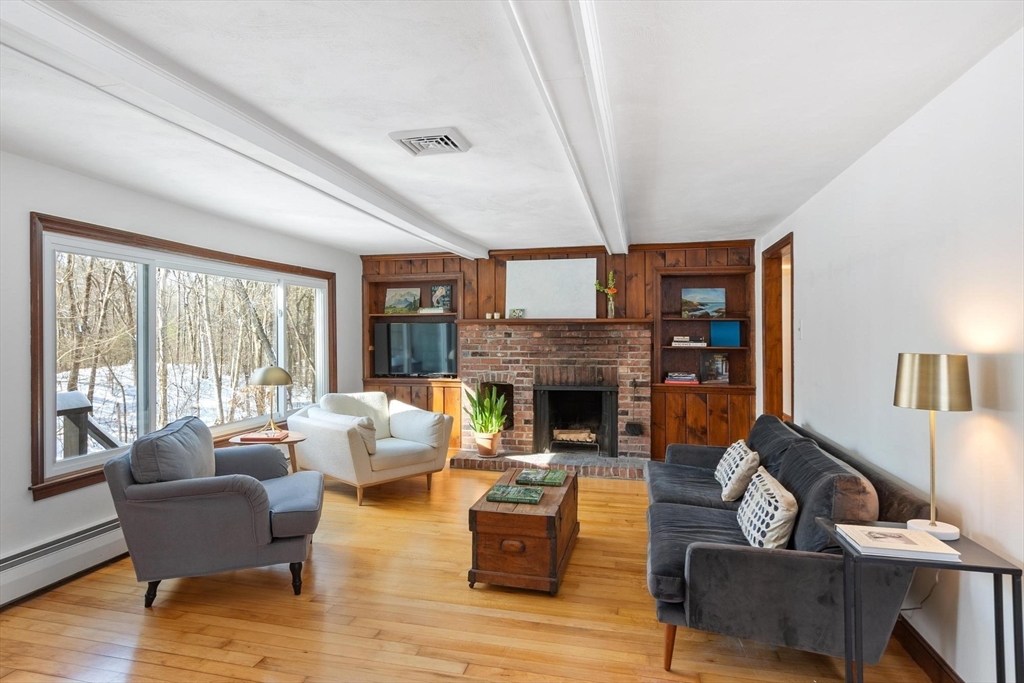 54 Birch Road Andover, MA 01810 - Photo 7 of 37 a living room with furniture and a fireplace