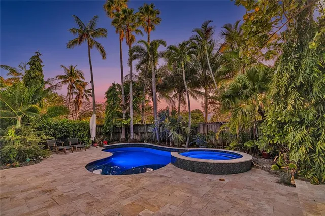 a view of a backyard with a fountain