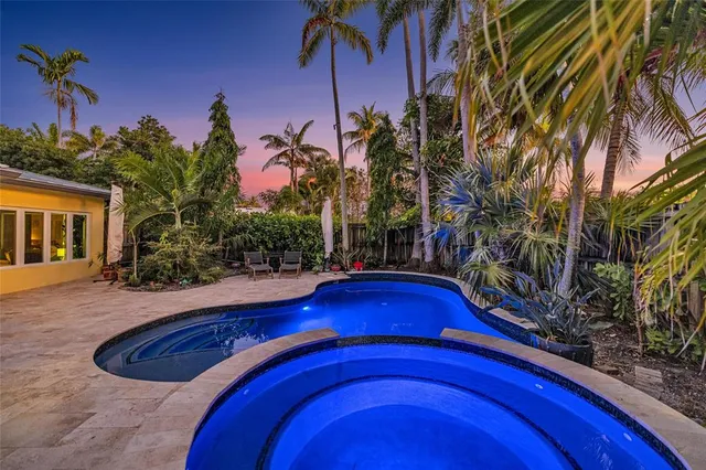 a view of swimming pool with a yard