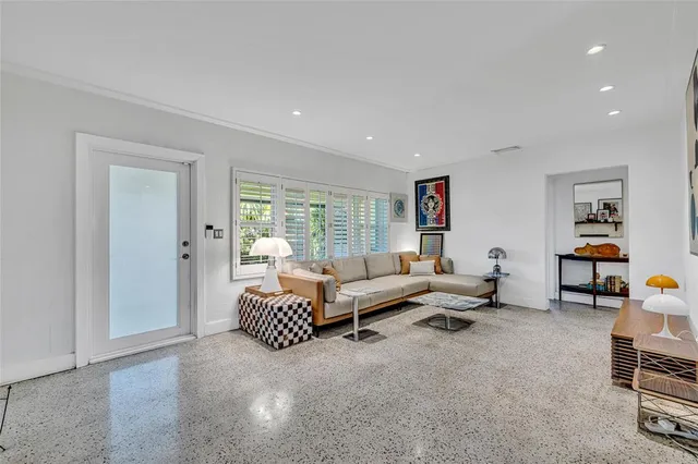 a living room with furniture and a window