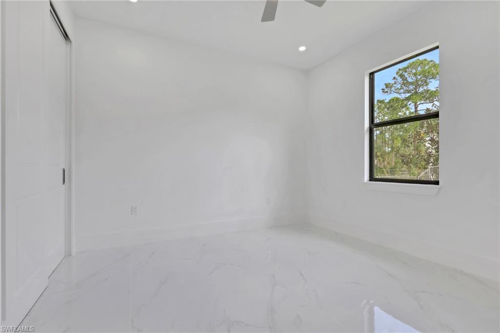 3780 6th Avenue Southeast Naples, FL 34117 - Photo 22 of 33 a view of an empty room with a window