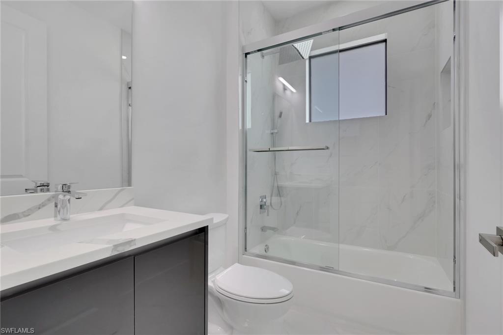 3780 6th Avenue Southeast Naples, FL 34117 - Photo 23 of 33 a bathroom with a sink toilet and shower