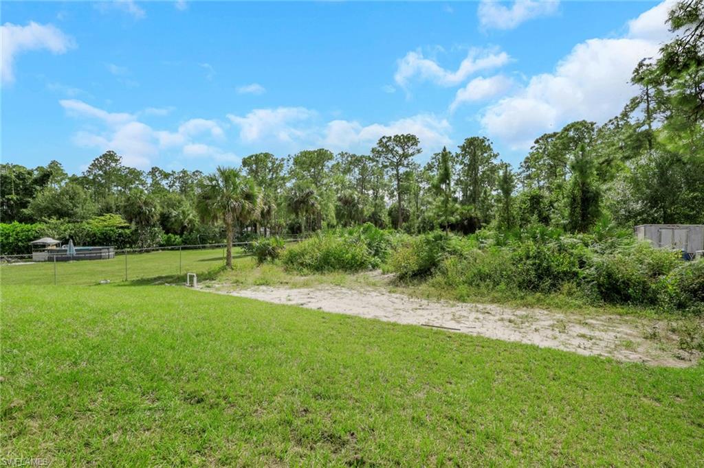 3780 6th Avenue Southeast Naples, FL 34117 - Photo 33 of 33 a view of a green yard