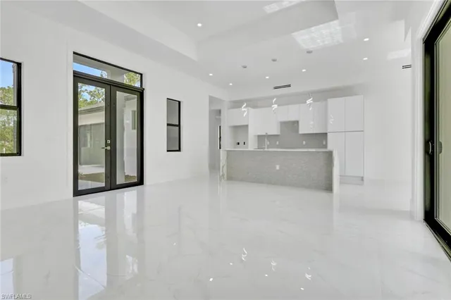 a view of a kitchen with large windows