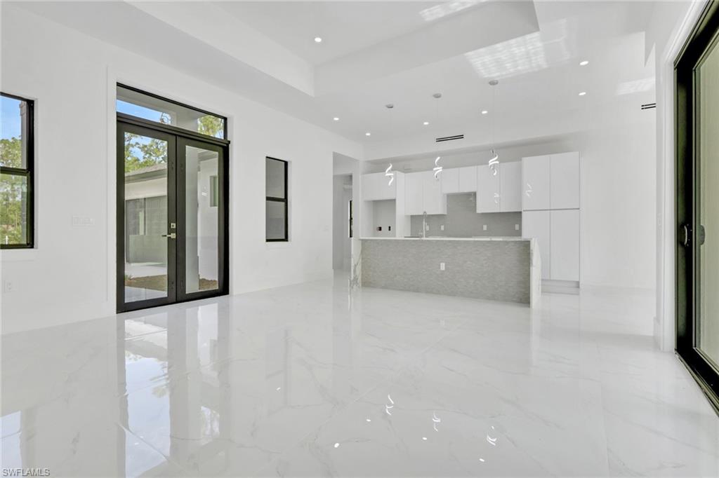 3780 6th Avenue Southeast Naples, FL 34117 - Photo 5 of 33 a view of a kitchen with large windows