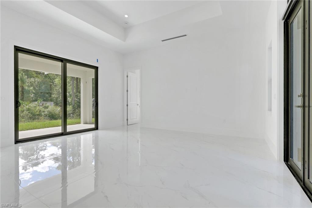 3780 6th Avenue Southeast Naples, FL 34117 - Photo 7 of 33 a view of an empty room with a window