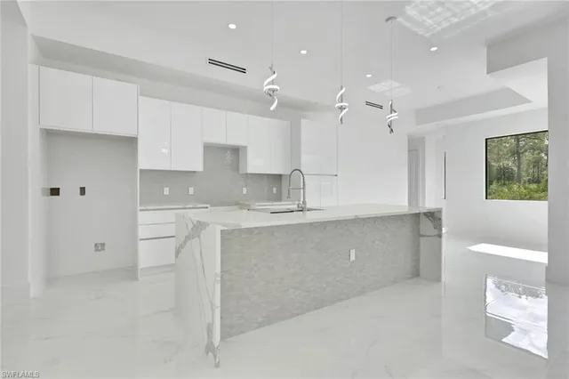 a large kitchen with cabinets