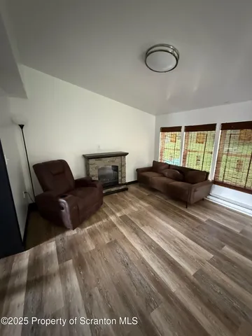a living room with a couch and a large window