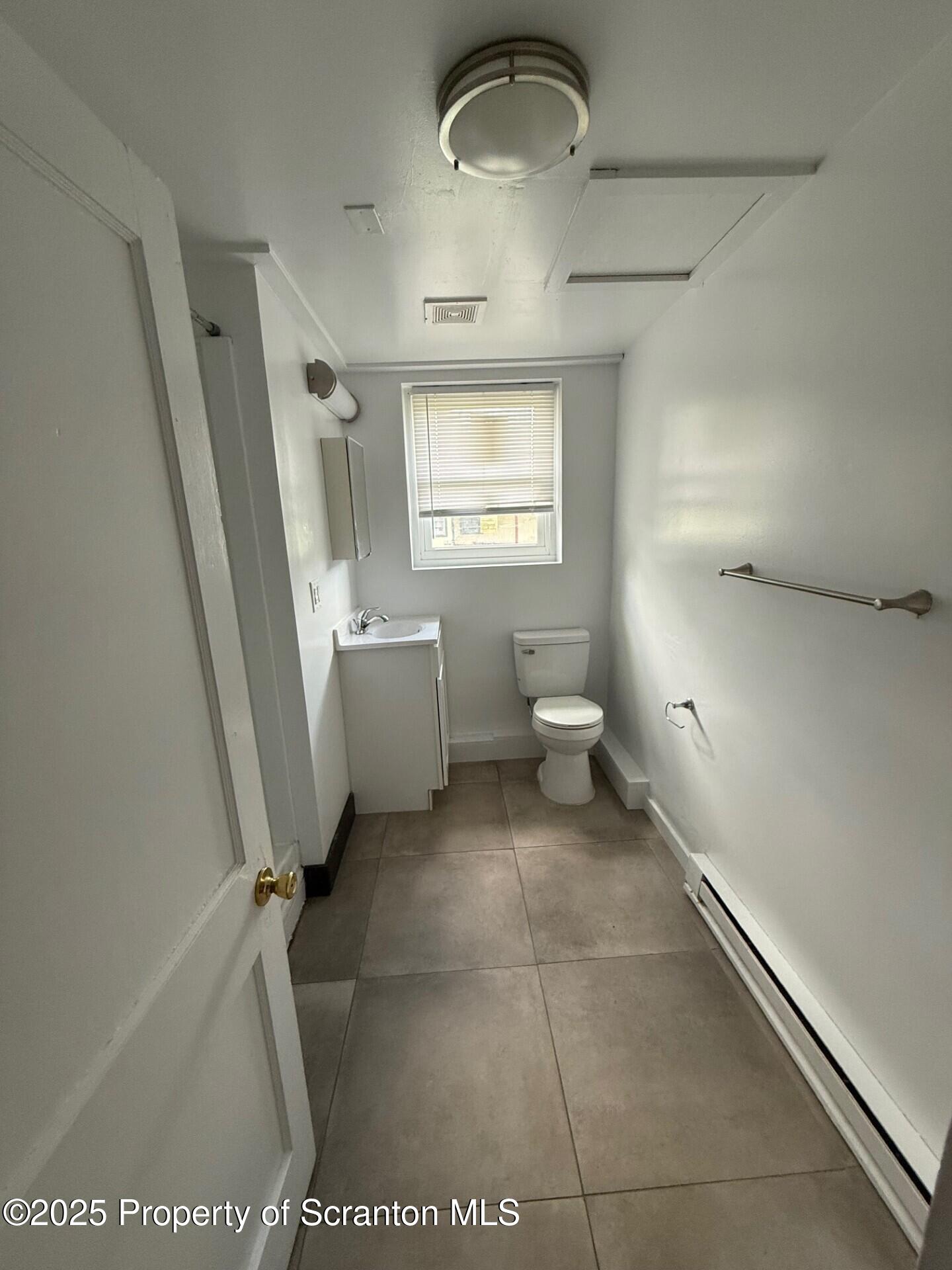 35 Keystone Road, Unit 4 MAPLE Gouldsboro, PA 18424 - Photo 9 of 10 a bathroom with a toilet sink and mirror