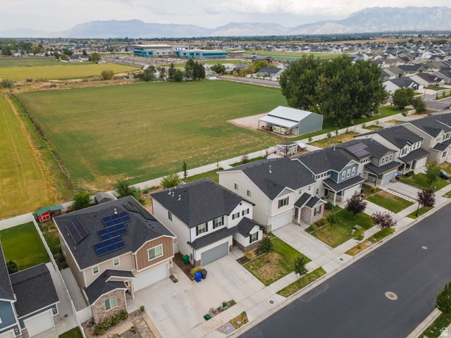 4594 West 1100 South West Point, UT 84015 - Photo 33 of 43 Modern residential community featuring new construction homes with clean architectural lines, dark asphalt roofing, and integrated two-car garages