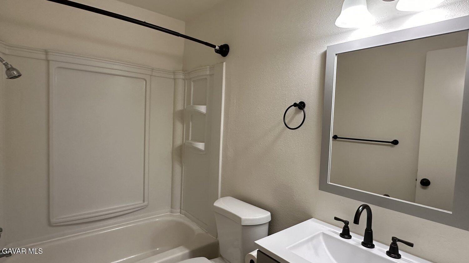 3901 Soranno Avenue, Unit C Bakersfield, CA 93309 - Photo 7 of 11 a bathroom with a shower and a sink