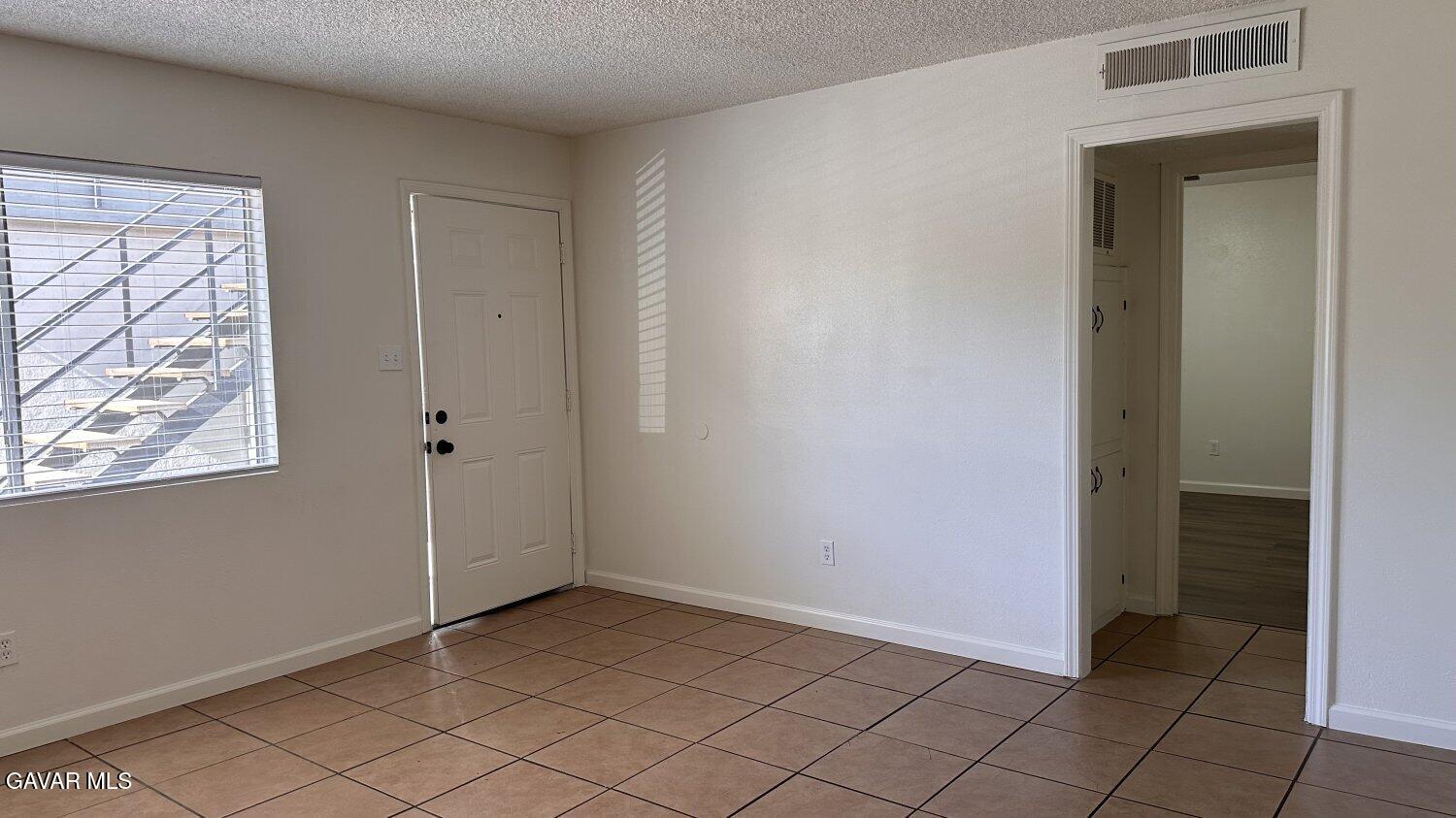 3901 Soranno Avenue, Unit C Bakersfield, CA 93309 - Photo 9 of 11 a view of an empty room and window