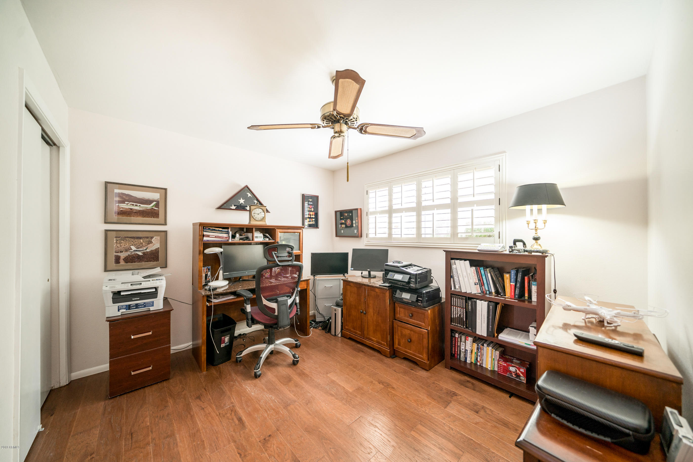 5525 East Thomas Road, Unit B6 Phoenix, AZ 85018 - Photo 12 of 21 a view of a workspace with furniture and a window
