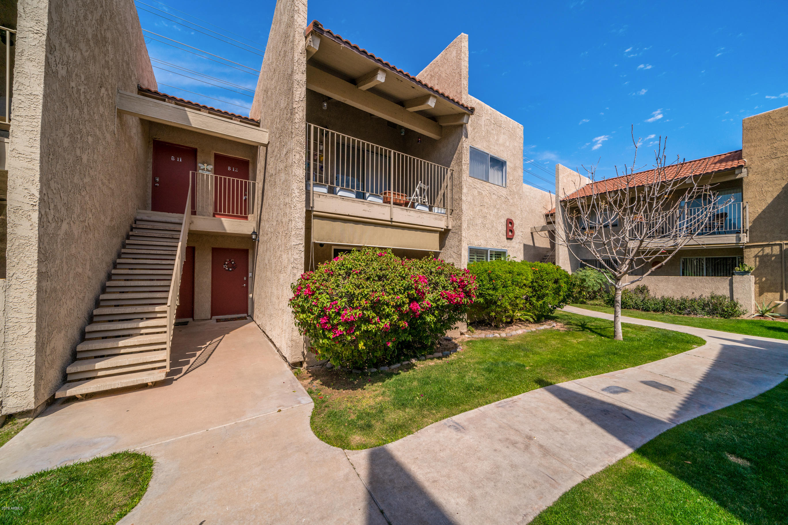 5525 East Thomas Road, Unit B6 Phoenix, AZ 85018 - Photo 16 of 21 a view of a house with a yard