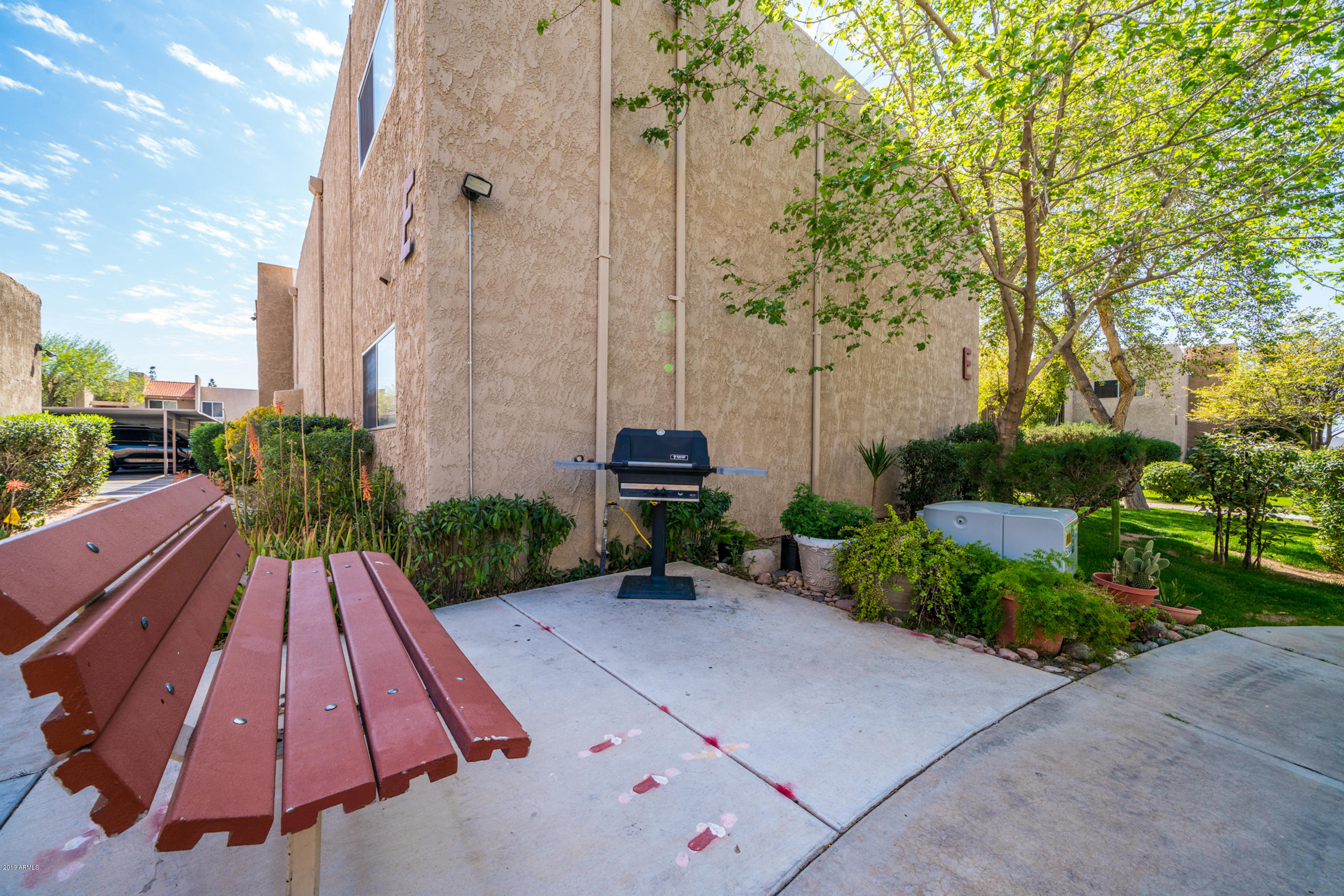 5525 East Thomas Road, Unit B6 Phoenix, AZ 85018 - Photo 18 of 21 a view of backyard with outdoor seating and trees