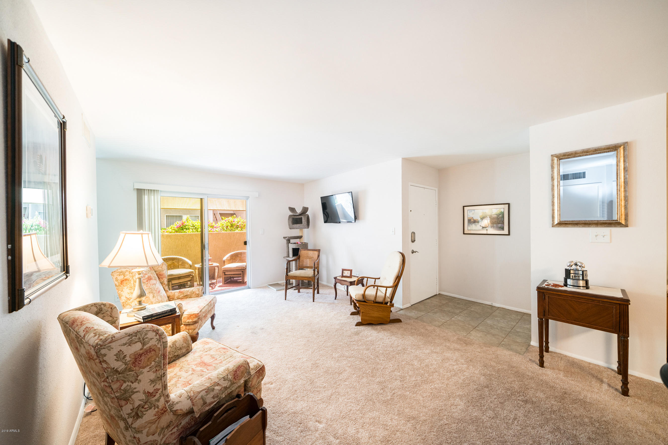 5525 East Thomas Road, Unit B6 Phoenix, AZ 85018 - Photo 19 of 21 a living room with furniture and a window