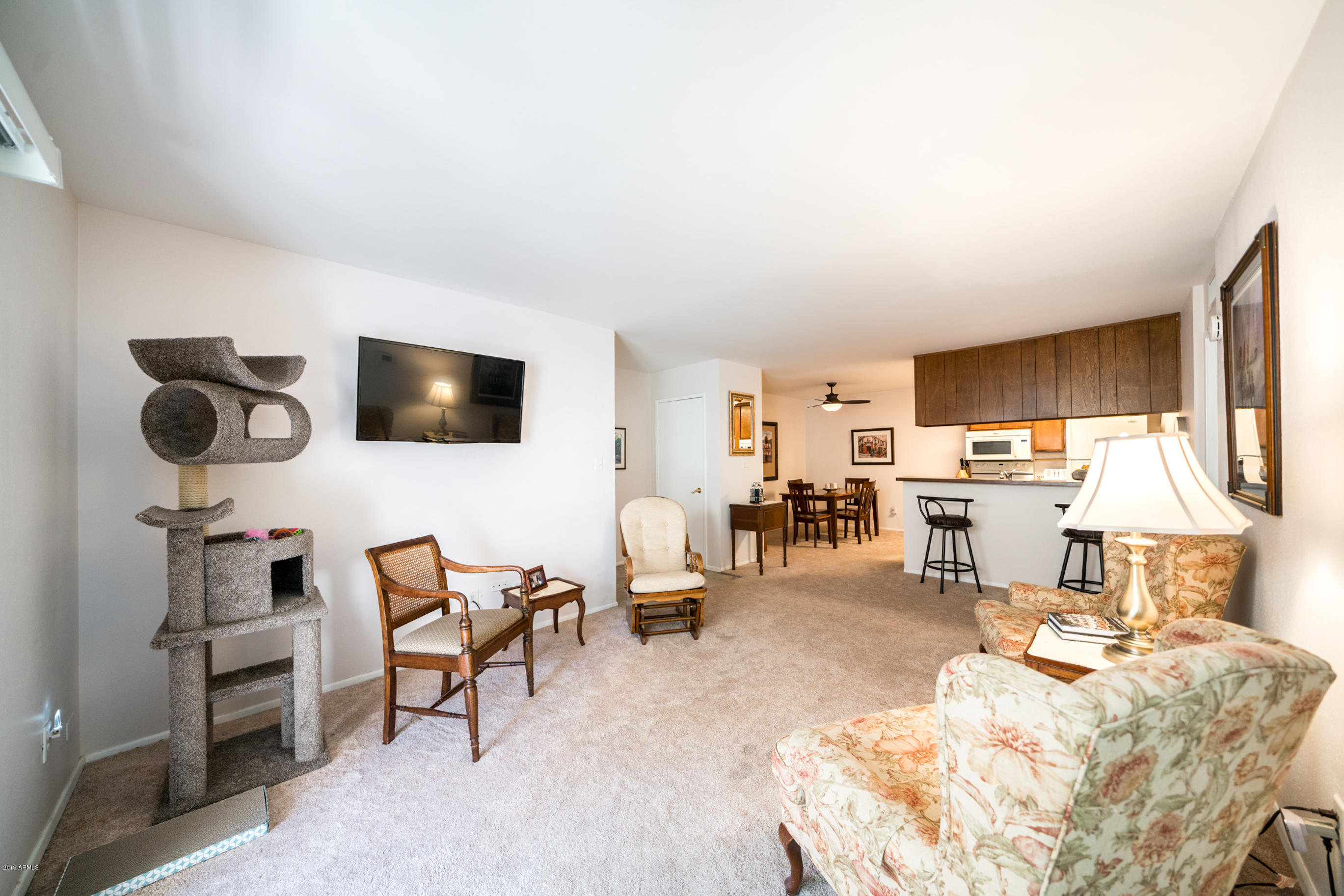 5525 East Thomas Road, Unit B6 Phoenix, AZ 85018 - Photo 6 of 21 a living room with furniture and a flat screen tv