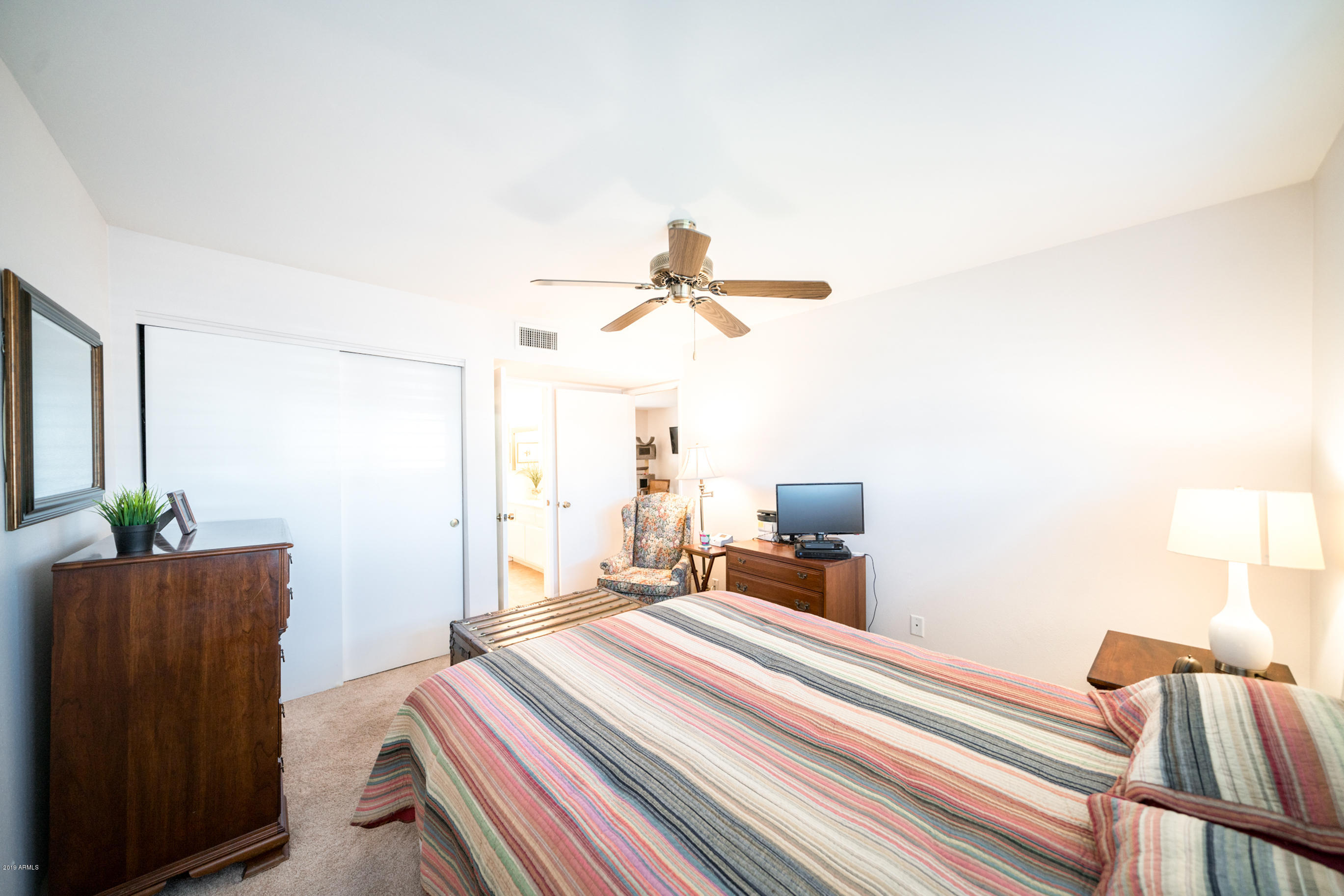 5525 East Thomas Road, Unit B6 Phoenix, AZ 85018 - Photo 7 of 21 a bedroom with a bed and a potted plant