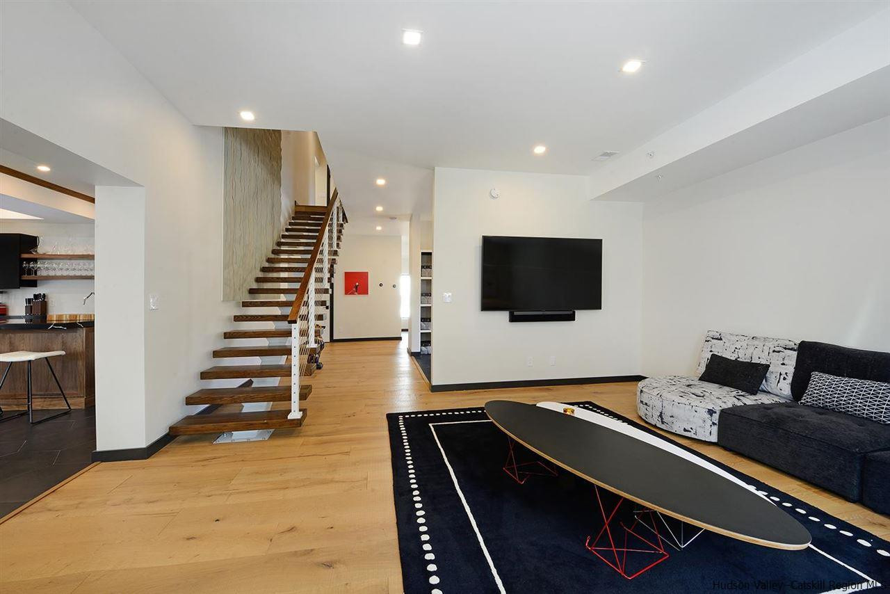 7717 Main Street Hunter, NY 12442 - Photo 22 of 32 a room with furniture and flat screen tv