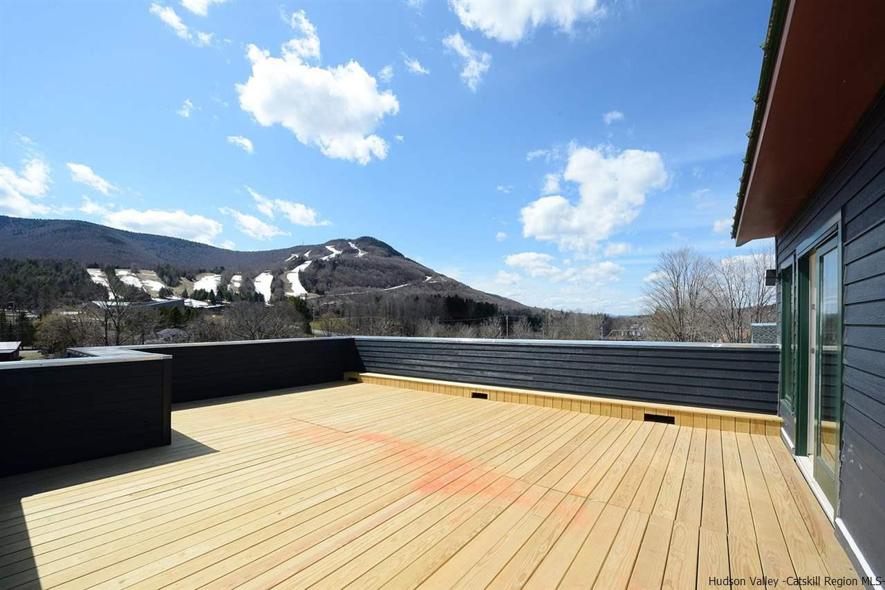 7717 Main Street Hunter, NY 12442 - Photo 30 of 32 a view of swimming pool with seating space and wooden floor