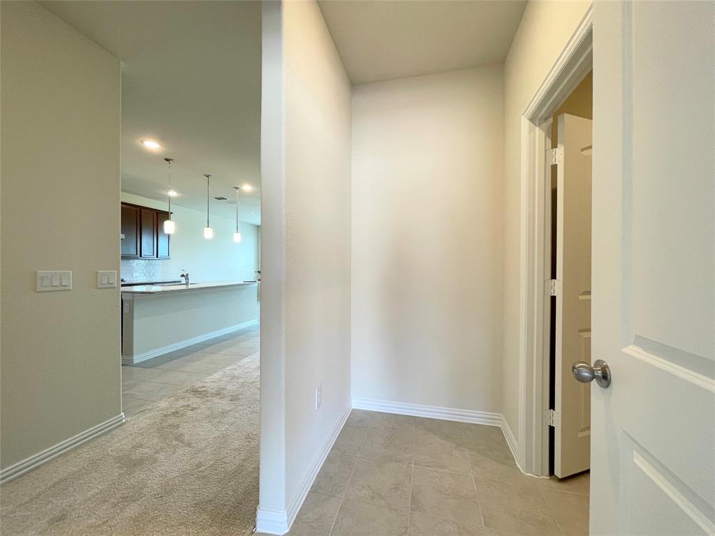 1805 Nelson Street Anna, TX 75409 - Photo 22 of 38 a view of kitchen with refrigerator and window